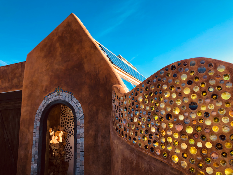 An Earthship Entryway with bottle wall